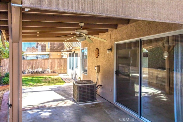 view of patio with ceiling fan, fence, and central AC unit