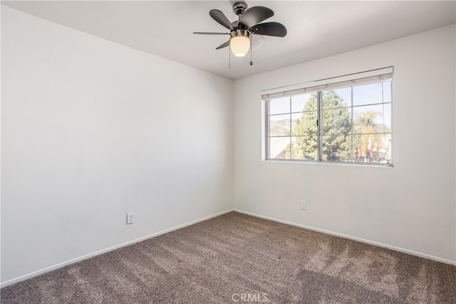 unfurnished room with carpet, ceiling fan, and baseboards