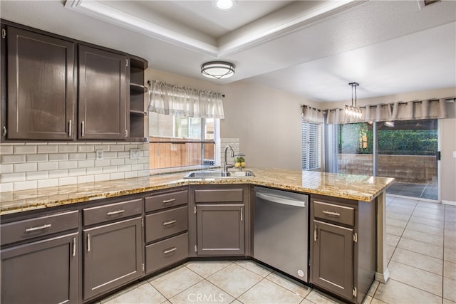 kitchen featuring open shelves, a raised ceiling, stainless steel dishwasher, a sink, and a peninsula