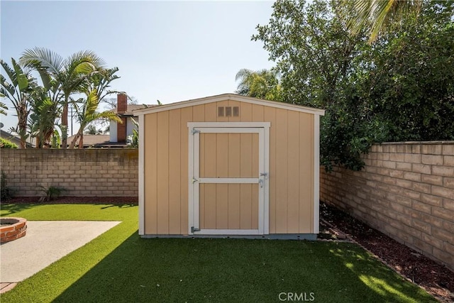 view of shed featuring a fenced backyard