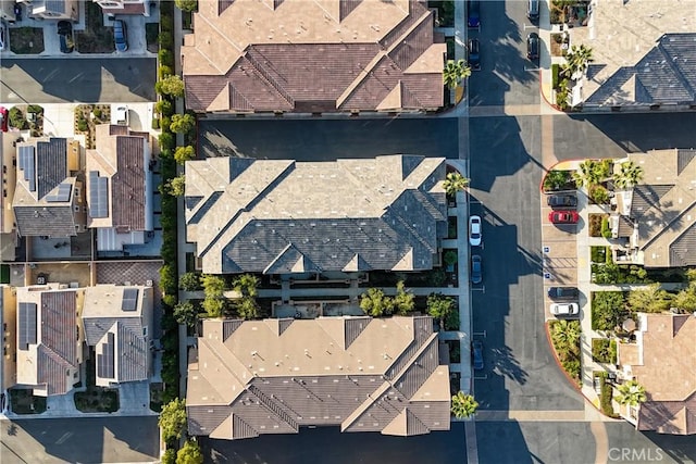 birds eye view of property with a residential view