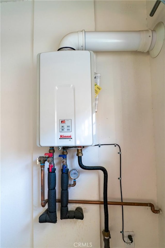 utility room with water heater