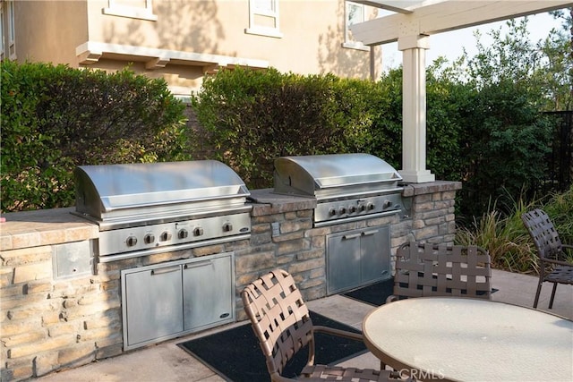 view of patio featuring an outdoor kitchen and area for grilling