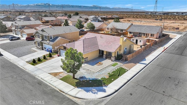 drone / aerial view featuring a mountain view and a residential view