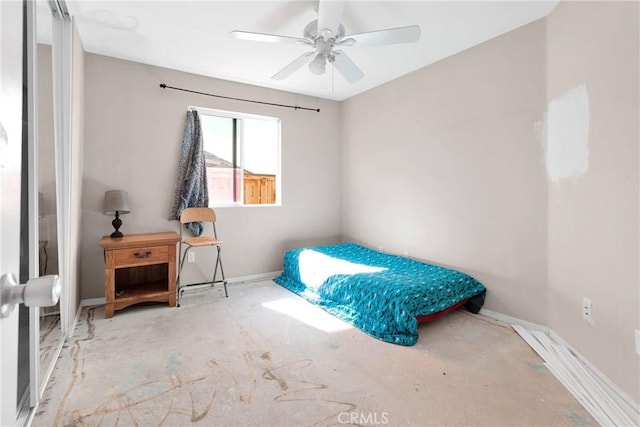 bedroom with a ceiling fan and baseboards