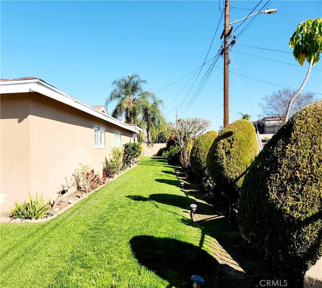 view of yard featuring fence