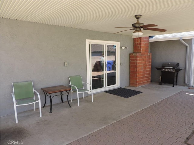 view of patio featuring ceiling fan and area for grilling