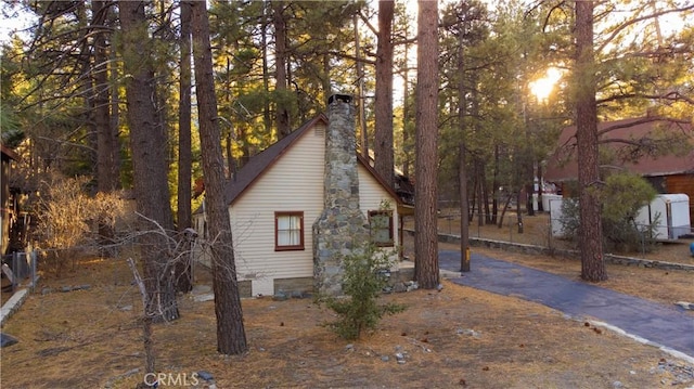 view of side of home with a chimney