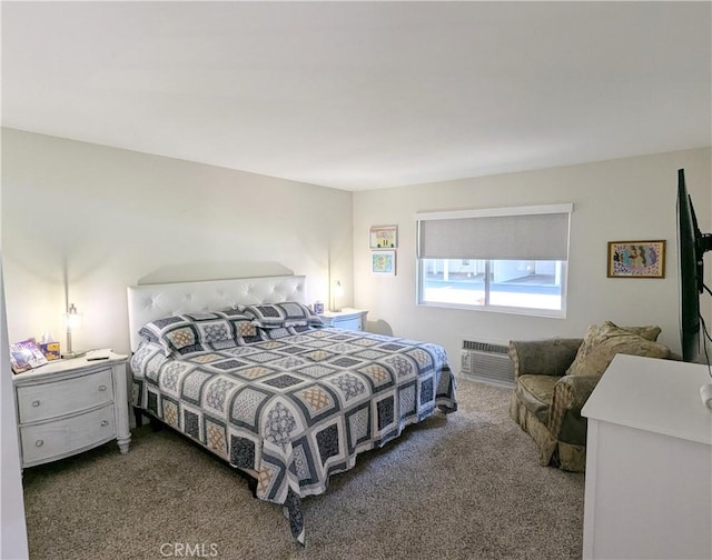 3311 Via Carrizo Unit P, Laguna Woods, CA 92637 - bedroom with dark carpet and an AC wall unit