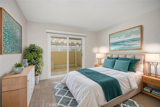 3311 Via Carrizo Unit P, Laguna Woods, CA 92637 - bedroom featuring access to exterior and light colored carpet