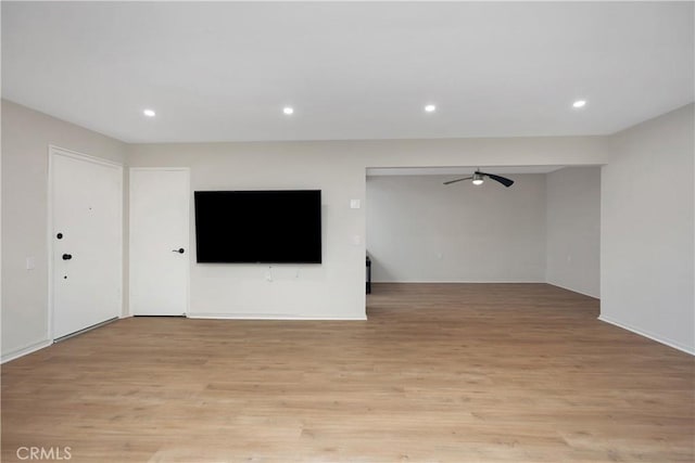 3311 Via Carrizo Unit P, Laguna Woods, CA 92637 - unfurnished living room featuring a ceiling fan, light wood-style flooring, and recessed lighting