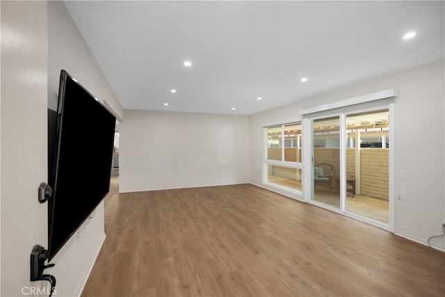 3311 Via Carrizo Unit P, Laguna Woods, CA 92637 - unfurnished living room featuring light wood-type flooring and recessed lighting