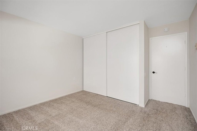 3311 Via Carrizo Unit P, Laguna Woods, CA 92637 - unfurnished bedroom with carpet floors and a closet