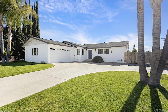 ranch-style home featuring an attached garage, driveway, fence, and stucco siding