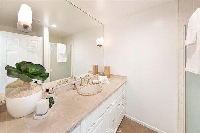 bathroom with vanity and baseboards