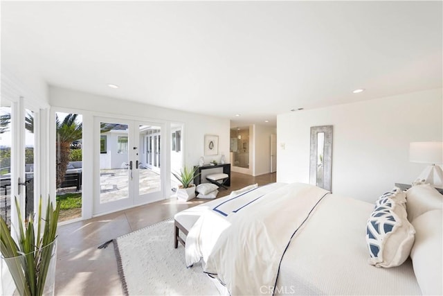 bedroom with recessed lighting, access to outside, concrete flooring, and french doors