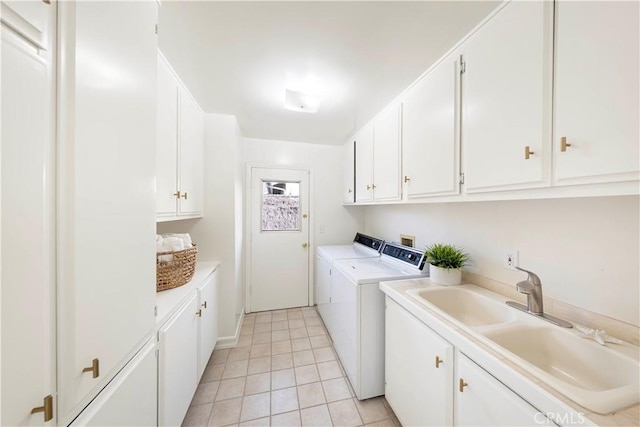 laundry room with separate washer and dryer, light tile patterned flooring, a sink, and cabinet space