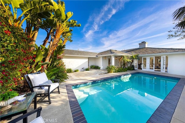 pool with a patio area