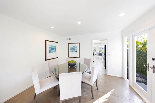 dining area with recessed lighting, visible vents, concrete flooring, and french doors