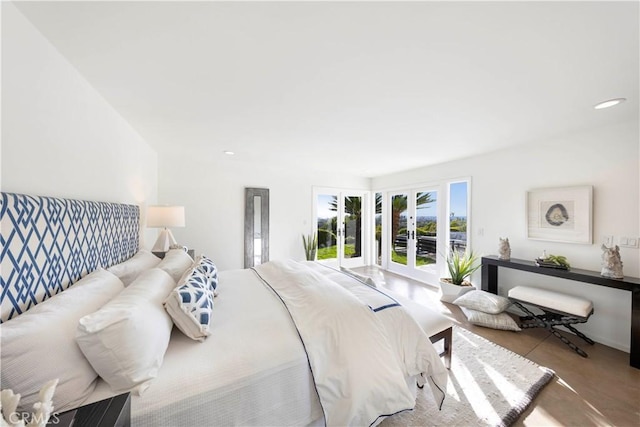 bedroom with access to exterior, recessed lighting, and french doors