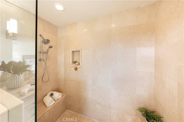 bathroom with a tile shower