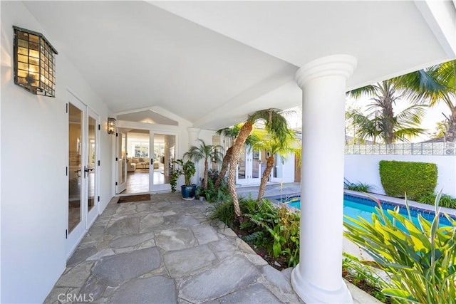 view of patio featuring a fenced in pool, french doors, and fence