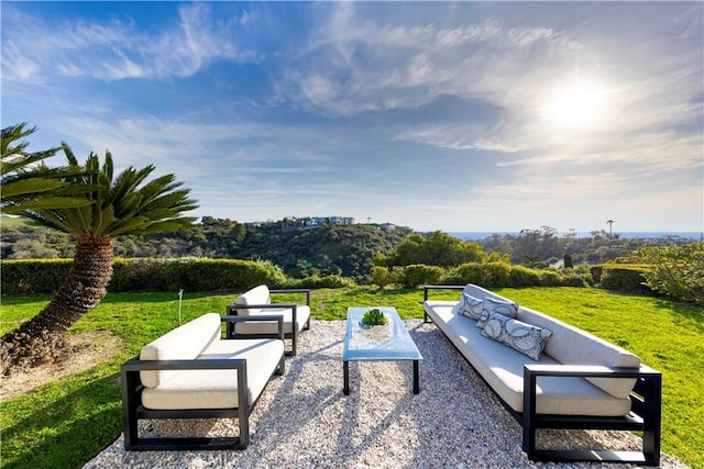 view of community with a yard, a patio, and an outdoor hangout area