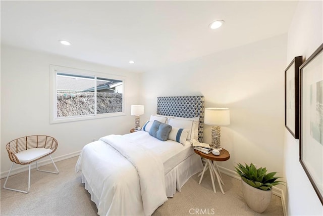 bedroom featuring recessed lighting, light colored carpet, and baseboards