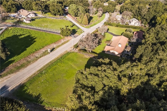 drone / aerial view featuring a view of trees