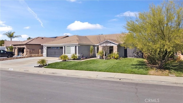 ranch-style house featuring a tile roof, stucco siding, concrete driveway, a front yard, and a garage