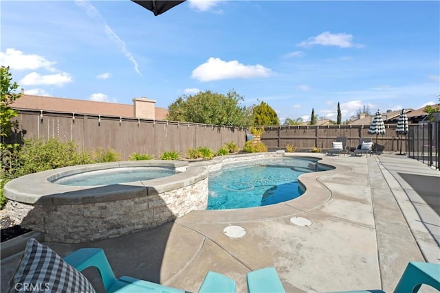 view of swimming pool with an in ground hot tub, a patio, a fenced backyard, and a fenced in pool