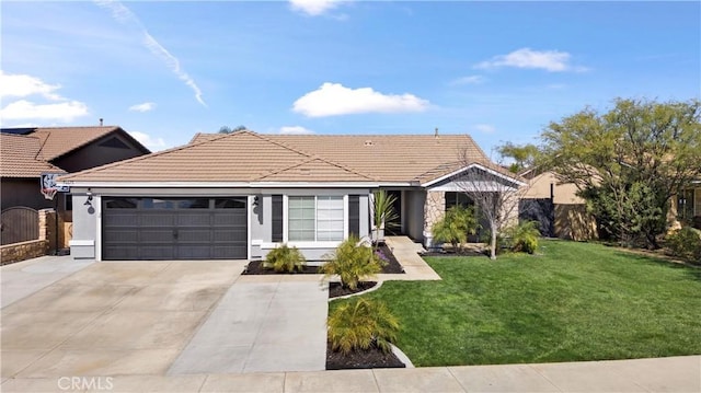 ranch-style home featuring a garage, a tile roof, fence, driveway, and a front lawn