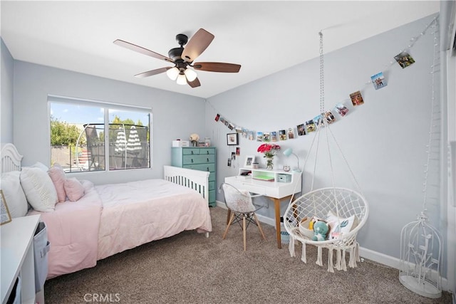 carpeted bedroom featuring baseboards, vaulted ceiling, and a ceiling fan