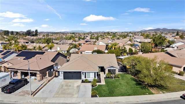 birds eye view of property featuring a mountain view and a residential view