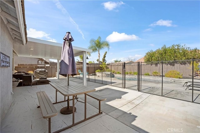 view of patio / terrace featuring area for grilling and a fenced backyard