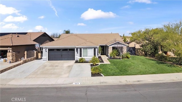 ranch-style house featuring a tile roof, an attached garage, a front yard, fence, and driveway