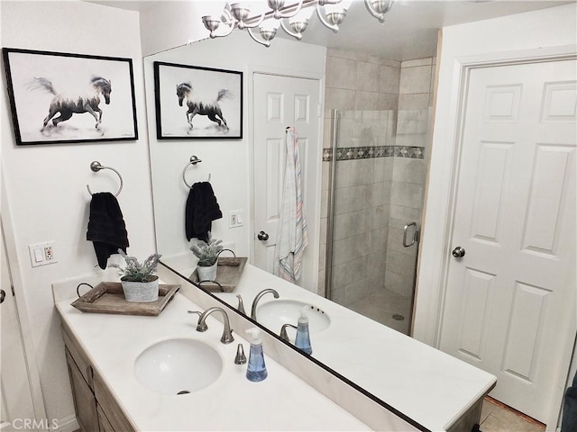 full bathroom featuring a stall shower and vanity