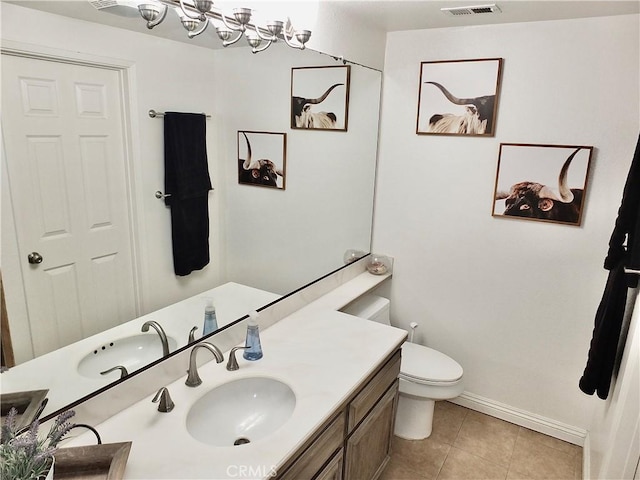 bathroom featuring visible vents, baseboards, toilet, tile patterned flooring, and vanity