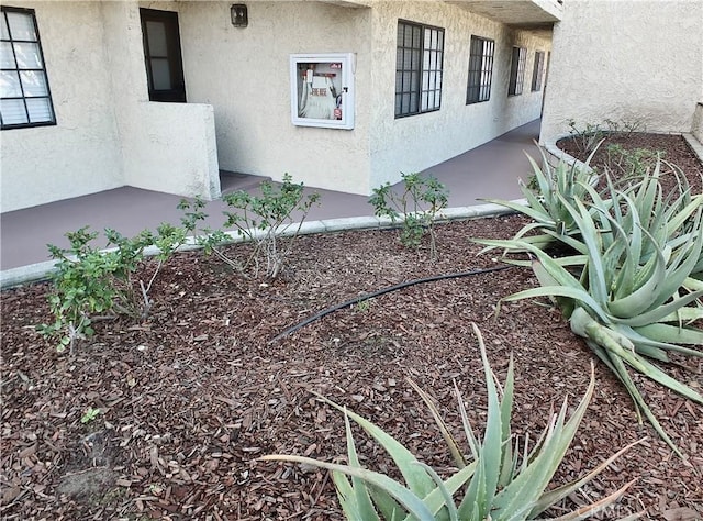 exterior space with stucco siding