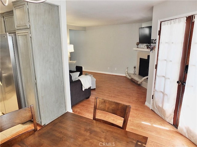 interior space with light wood-style floors and baseboards