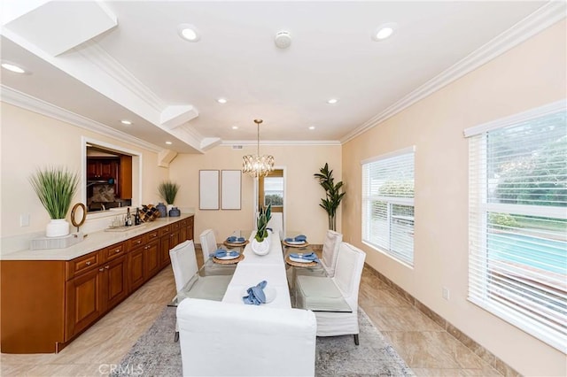 dining space featuring a chandelier, crown molding, and recessed lighting