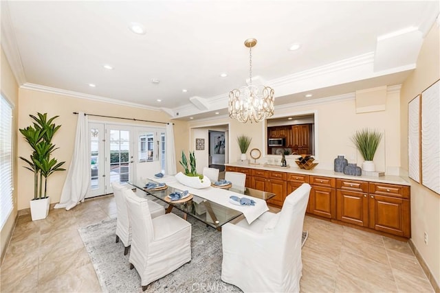 dining space with a chandelier, recessed lighting, french doors, and crown molding