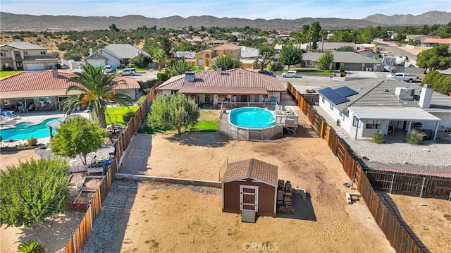 bird's eye view featuring a residential view and a mountain view