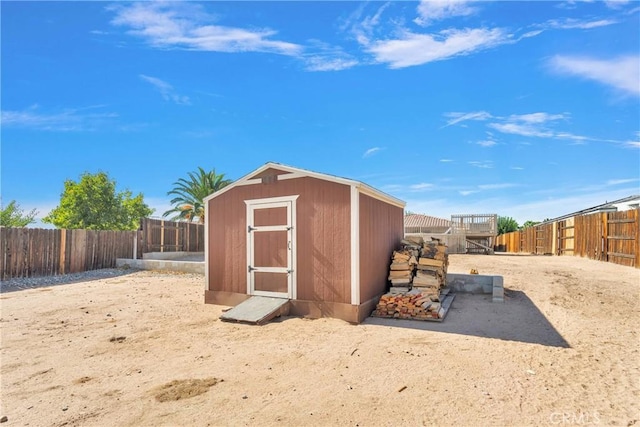 view of shed featuring a fenced backyard