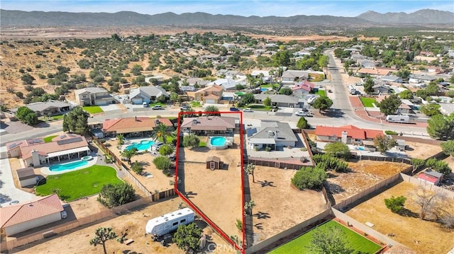 birds eye view of property with a residential view and a mountain view