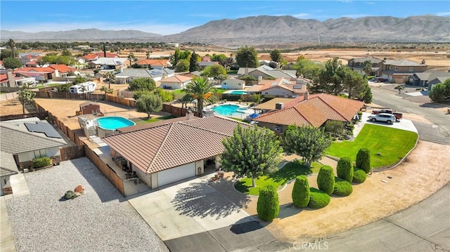 drone / aerial view with a residential view and a mountain view