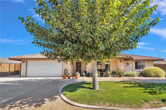 view of front facade with a garage, concrete driveway, fence, and stucco siding