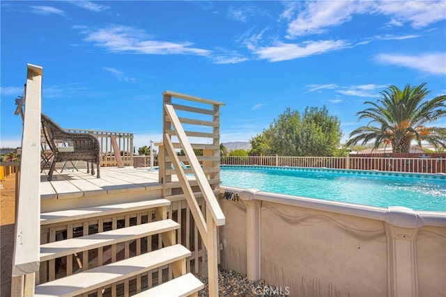 view of pool with a fenced in pool