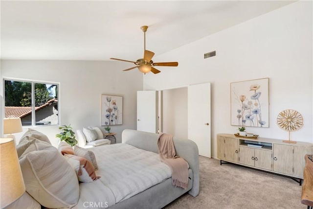 bedroom with light carpet, lofted ceiling, visible vents, and a ceiling fan