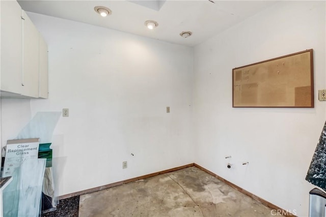 laundry room with baseboards